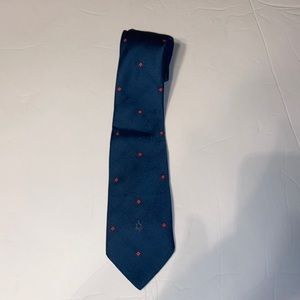 Christian Dior blue necktie with red square accents.